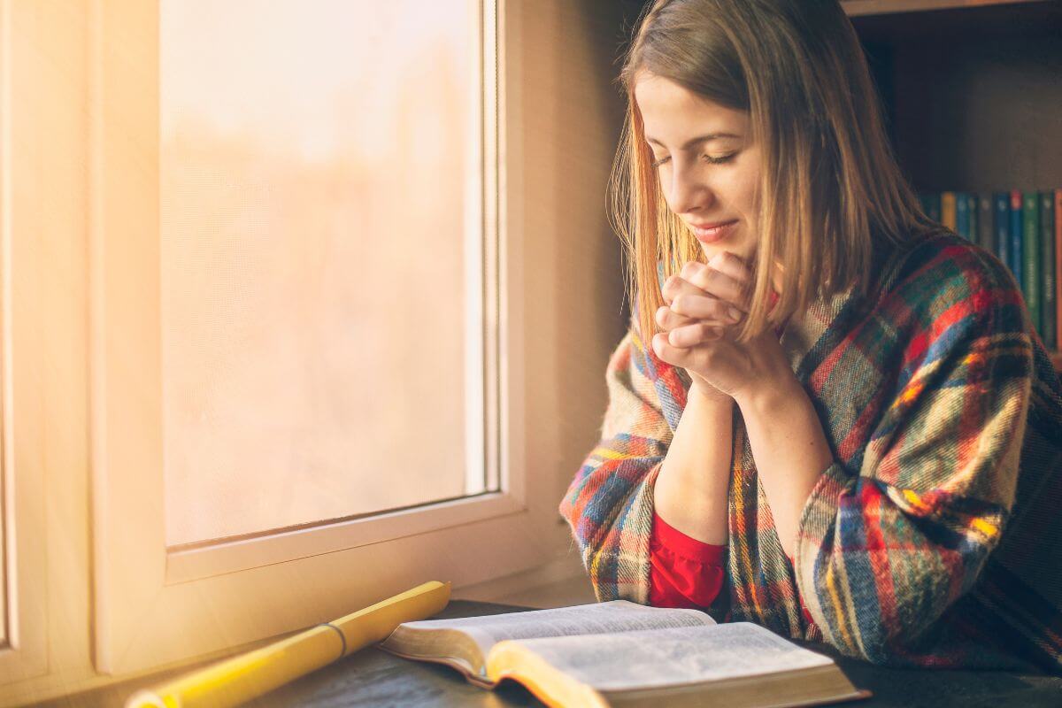 woman speaking God's truth over fear in prayer