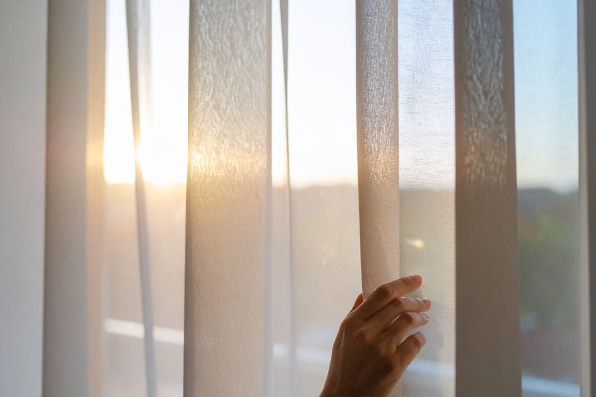 Morning sunlight shining through a window after a difficult night, symbolizing hope and a new beginning