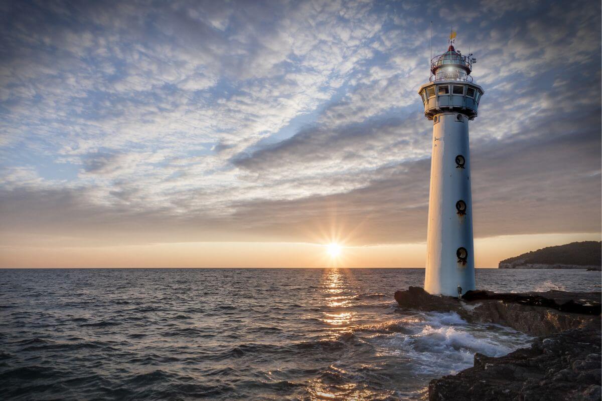 A lighthouse standing firm at sunrise, symbolizing God's unchanging faithfulness when the future feels uncertain.