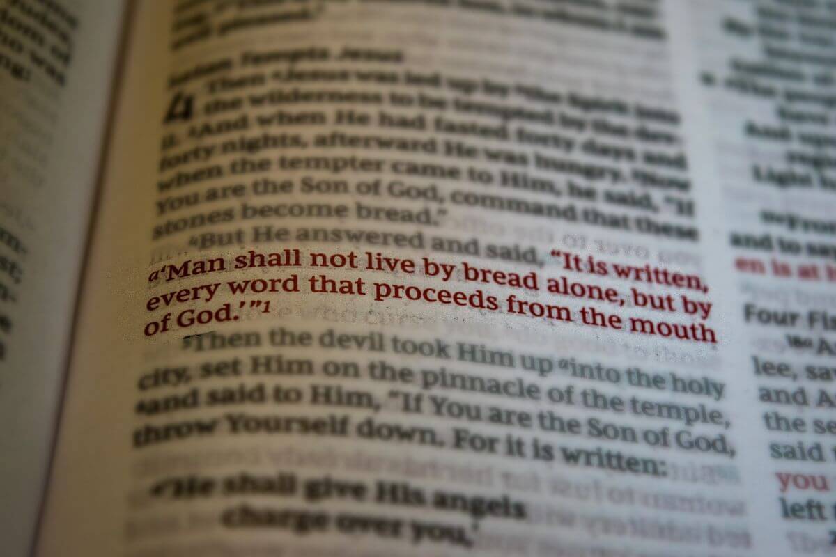 bible opened to Matthew chapter 4 verse 4 for God's written word to overcome fear and doubt