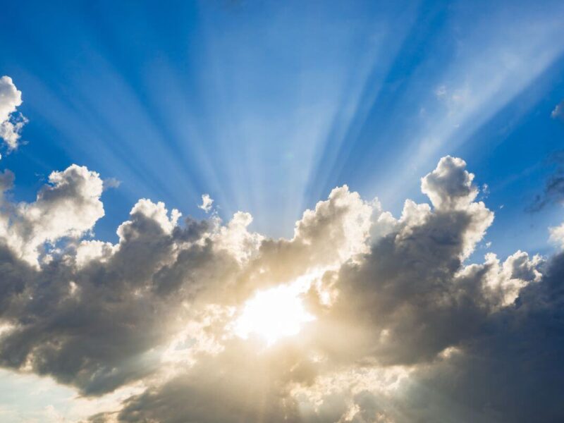 Light breaking through dark clouds, symbolizing how to overcome fear and doubt with God's Word.