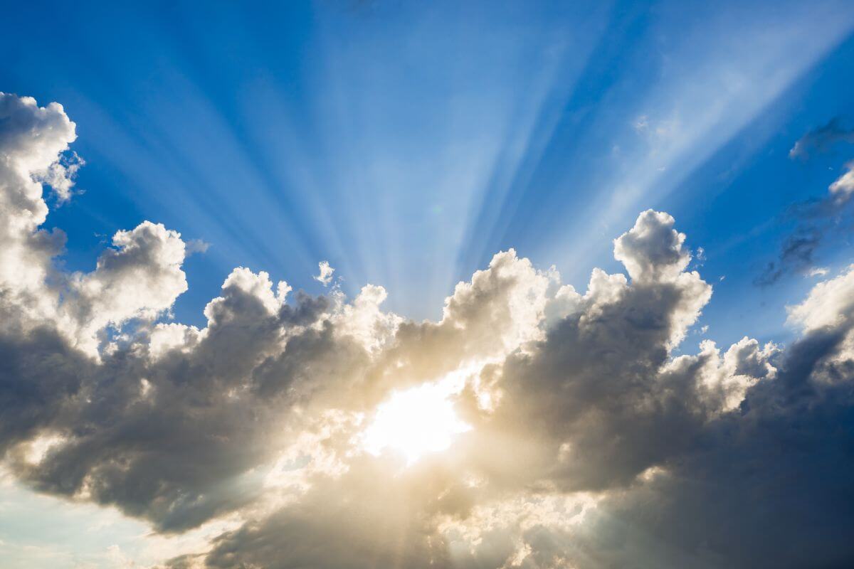 Light breaking through dark clouds, symbolizing how to overcome fear and doubt with God's Word.