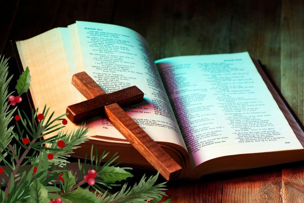 Cross on an open Bible in a Decorated table symbolizing that life is found in Jesus.