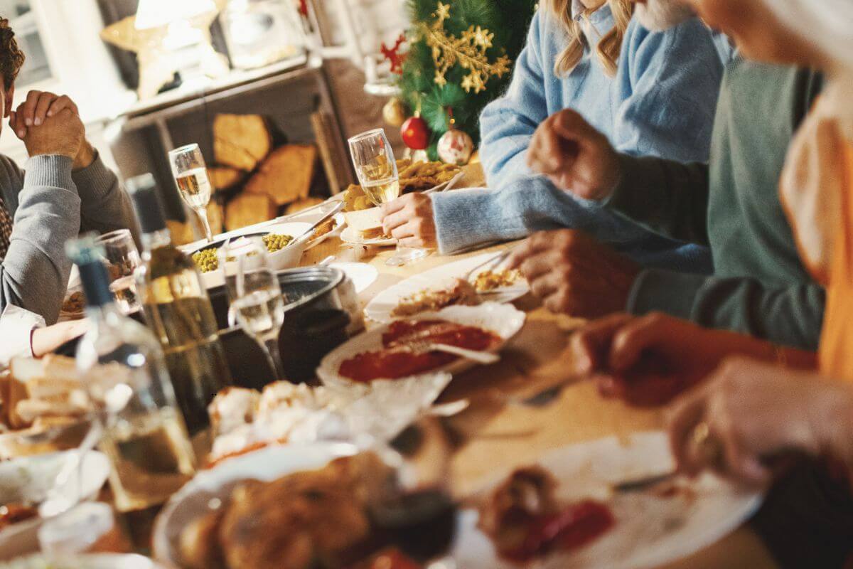 Family members connecting across a Christmas dinner table